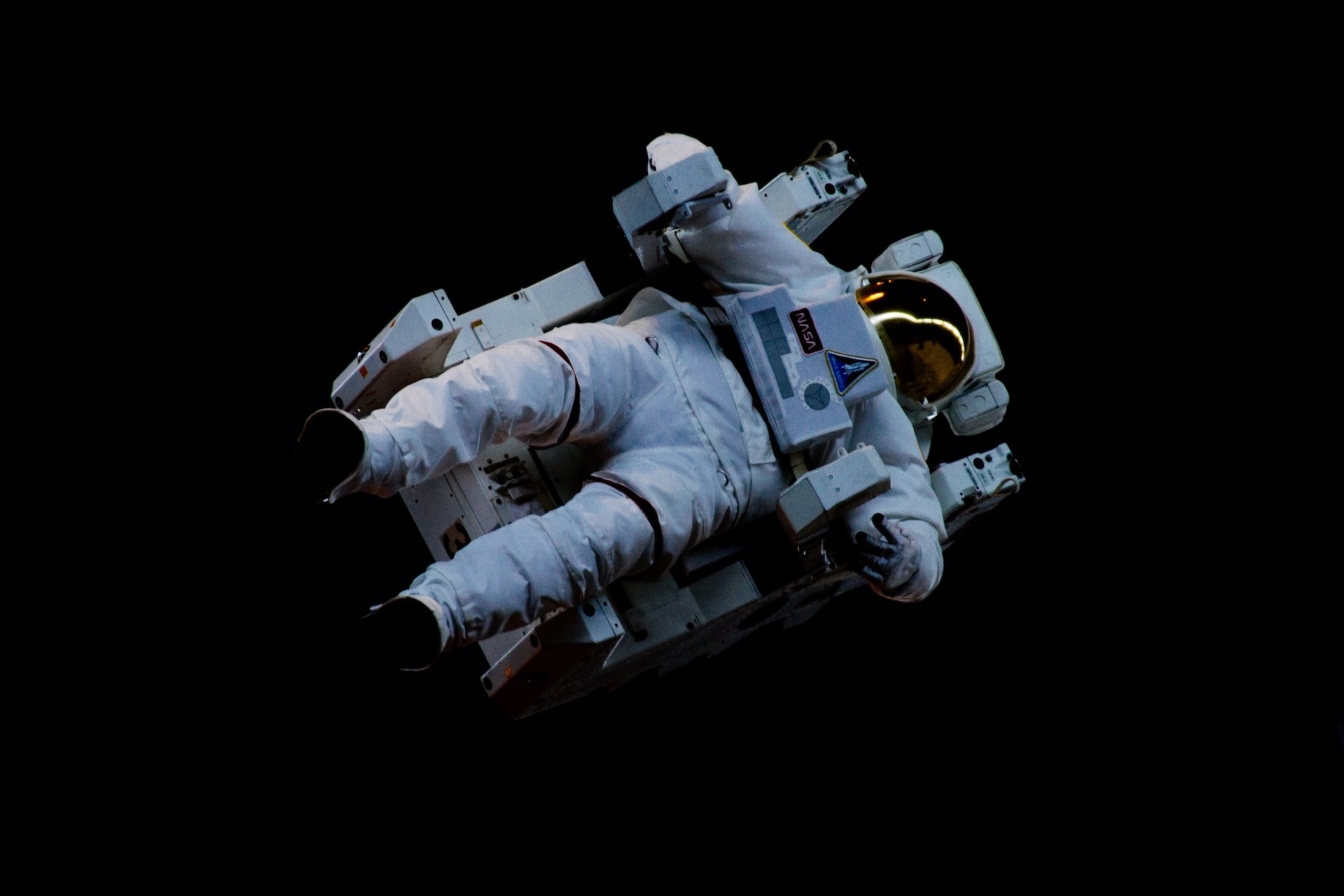 Image displaying an astronaut suit floating in space